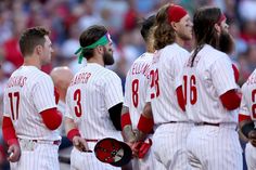 a group of baseball players standing next to each other