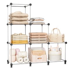 four tiered shelving unit with towels, blankets and other items on top of it