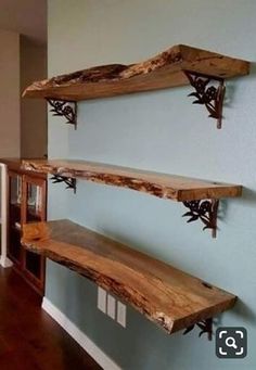 two wooden shelves on the wall in a room