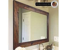 a bathroom sink with a mirror above it