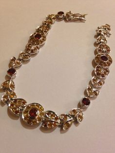 Vintage Sterling silver made into a cool bracelet . Faceted Golden Citrine and deep Garnets Very unusual All jewelry is shipped in a nice gift box. Check out our over a THOUSAND great reviews Engraving is $4 per letter and is not always perfect depending on the piece. It can take a few days if the jeweler is busy. This is payable to Paypal Judithsltd@gmail.com Elegant Garnet Bracelets As Gift, Elegant Garnet Bracelet As Gift, Elegant Garnet Bracelet For Gift, Elegant Amber Citrine Bracelet, Sterling Silver Round Bracelet As Gift, Elegant Brown Bracelet Jewelry, Handmade Silver Garnet Bracelets, Formal Sterling Silver Hand Set Bracelet, Collectible Silver Garnet Jewelry