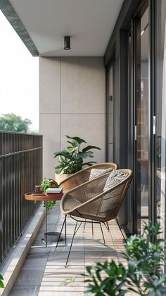 a balcony with two chairs and a table on the floor next to potted plants