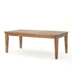 a wooden table sitting on top of a white floor