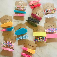 there are many different types of hair clips on the table with each one's own name