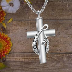 This memorial necklace features a unique design that combines a fish hook with a cross, symbolizing faith and remembrance. It's a heartfelt piece for any fishing enthusiast who wishes to keep the memory of their loved one close. Made from solid 925 sterling silver, this urn necklace is nickel-free, lead-free, cadmium-free, and hypoallergenic, making it safe and comfortable for sensitive skin. It won't cause irritation or discoloration. This necklace serves as a touching way to carry the ashes of Urn Pendant, Urn Necklace, Silver Fish, Urn Necklaces, Memorial Necklace, Love Symbols, Fish Hook, Gift Giving, Solid 925 Sterling Silver