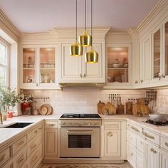 a kitchen filled with lots of white cabinets and counter top space next to a window