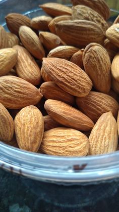 almonds in a plastic container on a table