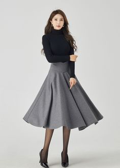 "Elevate your winter wardrobe with our deep gray wool midi skirt featuring a stylish V-shaped waist.The sophisticated gray hue exudes elegance, while the premium wool fabric ensures both style and warmth. The thoughtfully designed buttons add a touch of refinement to your ensemble. This versatile midi skirt effortlessly transitions from day to night, making it a must-have choice for those who seek both fashion and coziness. DETAILS * 30% wool, 30% fiber, 40% polyester * Fully satiny liner * Without pockets * Back zipper closure * Pleated Circle skirt * Below knee length skirt * Perfect for Winter, autumn MODEL SIZE Bust 85 cm(33.4\") Waist 67 cm(26.7\") Height 168cm (5' 6\") She wears size XS Choose CUSTOM Order if you * Need a better fit * Can't find your size in our size Chart * Chang th Midi Skirt Winter, Custom Skirt, Autumn Skirt, Long Wool Skirt, Skirt Winter, Solid Skirt, Skirt Pleated, Winter Skirt, Wool Skirt