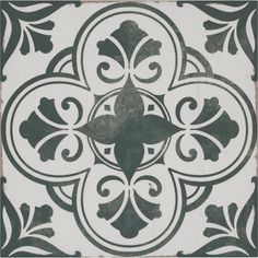 a black and white tile with an ornate design