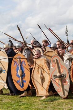 a group of men with shields and swords