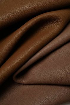 a close up view of a brown leather textured material that is very soft and smooth