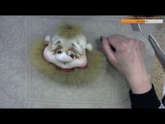 a person is cutting up a fake clown's head