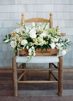 a wooden chair with flowers on it