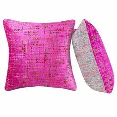 two pink and grey pillows on a white background, one is made out of fabric