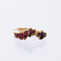 Pairs well with matching Earrings and Pendant! A minimal garnet ring with a comfortable dainty ring shank. Stacks well with other rings, particularly colored gemstone rings. This garnet is completely natural, raw, and uncut. Although Garnets are the birthstone for January, these gems are super trendy and can be worn by and gifted to just about anybody! -Three Genuine Rough Garnet, Uncut -Gem size – 3-5mm each -Pure 14k gold fill Shank -24k Gold Dipped Please read our FAQ for more information on Luxury Modern Garnet Jewelry, Raw Ruby Engagement Rings, Garnet Jewelry Stone, Modern Luxury Garnet Rings, Luxury Modern Garnet Ring, Garnet Engagement Ring Stone, Raw Garnet Ring, Luxury Classic Garnet Ring, Garnet Ring Size 11