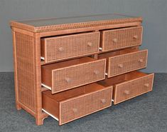 a wicker dresser with six drawers on top