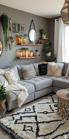 a living room filled with lots of furniture and plants on the wall above it's couch