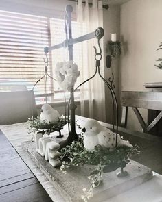 a table with candles and flowers on it in the shape of polar bear figurines