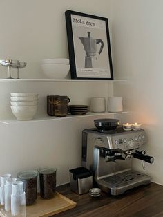 a coffee maker sitting on top of a wooden counter