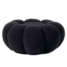 a black poufce cushion on a white background with no one in the photo