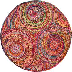 a round rug made out of multicolored circles