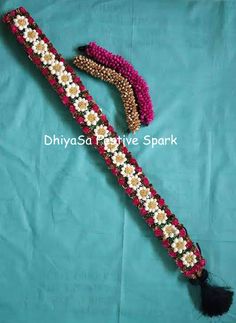 the beaded bracelet is decorated with flowers and tassels