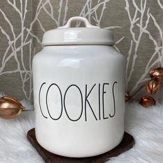 a cookie jar sitting on top of a white fur covered floor