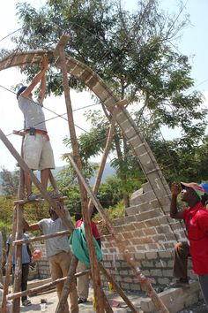 some people are building a structure out of bricks