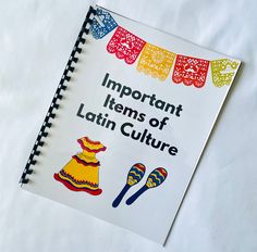 an important items of latin culture book on a white sheet with colorful flags and tassels