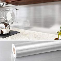 a kitchen counter top with a roll of paper on it and an image of a stove in the background