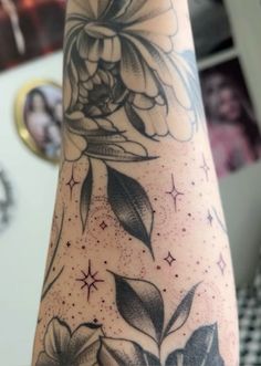 a person with a flower tattoo on their arm