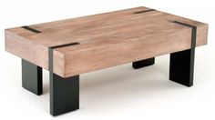 a wooden table with two black legs on it