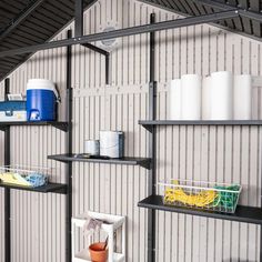 several shelves with various items on them in a room