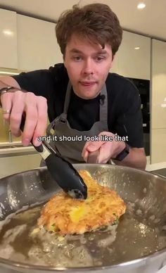 a man in an apron is cooking food on a pan with the words, i don't think it should look like that