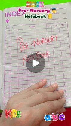 a person holding a notebook with writing on it and the words fire nursery note book