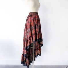 This bohemian hi low ruffle skirt is full of sway and flow. It's a graceful, romantic maxi skirt that's hits at the knee in the center front and drapes beautifully all the way around. A full twirling skirt, this can easily be paired with flats for a day at the beach, or paired with our infinity convertible tops for a more formal occasion. It's lightweight, easy to wash/dry and so easy to pack for all your vacations! Note: You will be stopped and admired when you wear this out! ► Size XS & S of P Cheap Flared Skirt For Beach, Cheap Flared Skirt Bottoms For Beach, Cheap Flowy Skirt For The Beach, Luxury Bohemian Multicolor Maxi Skirt, Cheap Multicolor Flowy Skirt, Summer Skirt Long, Maxi Skirt Formal, Bohemian Robes, Pink Bohemian