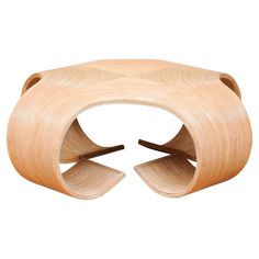 a wooden table with two curved sections