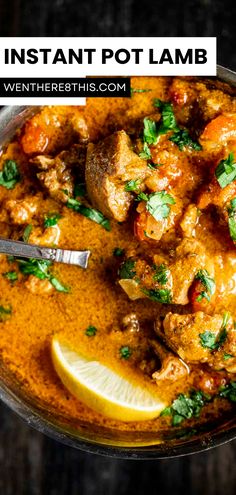 a bowl filled with chicken curry and garnished with cilantro, lemon wedges and parsley