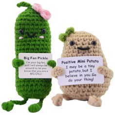 two small crocheted items one with a sign that says,'big fan pickle positive mini potato and the other has a tiny potato