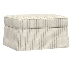 a white and red striped ottoman with a brown stripe on the bottom, sitting in front of a white background