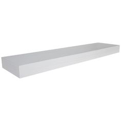 a white shelf sitting on top of a wall