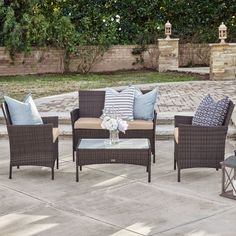 patio furniture set with blue and white pillows