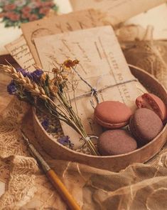 an old fashioned box with macaroons and flowers