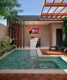 an indoor swimming pool surrounded by greenery