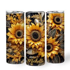 three yellow sunflowers on black with the word, michele written in gold