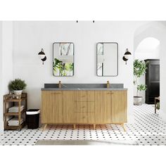 a bathroom with black and white tile flooring and two mirrors on the wall above it