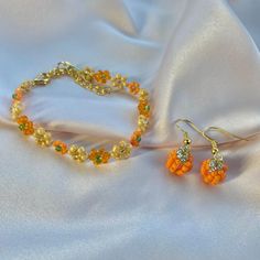 Handmade autumn themed jewellery set made with glass seed beads bracelet and earrings Beaded Pumpkin Bracelet, Orange Faceted Beads For Jewelry Making, Orange Faceted Beads For Crafting, Orange Beaded Czech Glass Jewelry, Orange Jewelry With Gold Beads For Gift, Orange Gold Beaded Jewelry For Gift, Orange Czech Glass Beaded Jewelry, Orange Beaded Bracelet, Pumpkin Bracelet