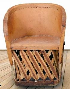 an old wooden chair sitting on top of a wooden floor