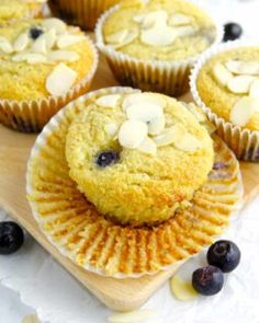 blueberry and almond muffins on a cutting board