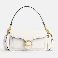 Slotting into your everyday with seamless and effortless appeal, the Coach Tabby 20 bag is a dependable staple. Slip it over the shoulder or carry it in hand or with your casual and dressier rotations. It is made from pebbled ivory leather with gold-tone branding that doubles as a sleek closure..Coach Tabby 20 shoulder bag.Ivory pebbled leather.Detachable top handle and shoulder strap, designer plaque, gold-tone hardware.Internal zipped compartment, slip pocket.Snap front flap closure.Designer colour: Chalk.Dimensions: H: 10.5cm x W: 19.5cm x D: 7cm Versatile Coach Bags With Detachable Handle, Versatile Coach Bag With Adjustable Strap, Classic Shopping Flap Bag With Adjustable Strap, Classic Flap Bag With Adjustable Strap For Shopping, Versatile Coach Bag With Detachable Strap, Versatile Coach Shoulder Bag With Double Handle, Versatile Coach Double Handle Shoulder Bag, Coach Satchel Shoulder Bag With Adjustable Strap, Coach Satchel With Adjustable Strap For Everyday